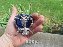 2 antique sterling silver salt shakers, 70 g, and blue glass vial
