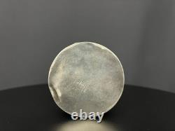 Ancient Asian powder compact in chased silver