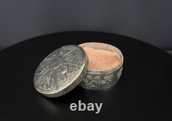Ancient Asian powder compact in chased silver