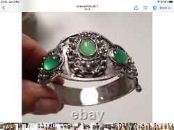 Ancient solid silver bracelet with green stones