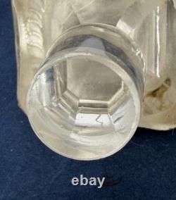 Antique Indonesian liqueur set with silver deity motifs, crystal decanter, and goblets