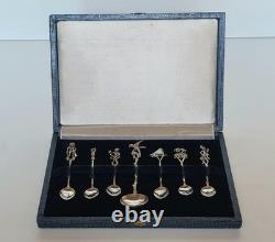 Antique box set of 7 small solid silver spoons, 833 silver, Colonial decoration, early 20th century