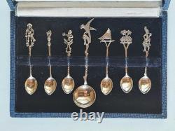 Antique box set of 7 small solid silver spoons, 833 silver, Colonial decoration, early 20th century
