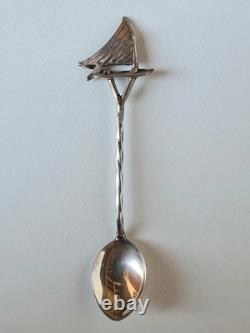 Antique box set of 7 small solid silver spoons, 833 silver, Colonial decoration, early 20th century