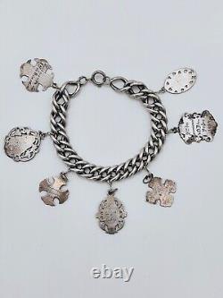 Antique charm bracelet with medals in solid silver, 19th century