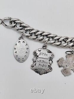 Antique charm bracelet with medals in solid silver, 19th century