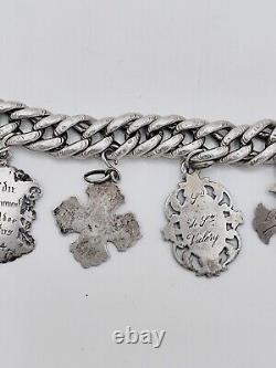 Antique charm bracelet with medals in solid silver, 19th century