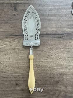 Antique pierced silver serving spoon with old man's hallmark