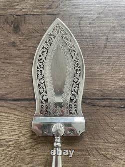 Antique pierced silver serving spoon with old man's hallmark