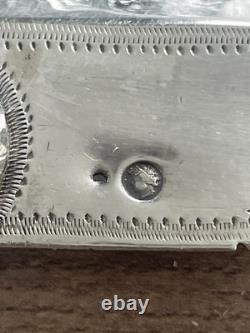 Antique pierced silver serving spoon with old man's hallmark