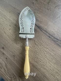 Antique pierced silver serving spoon with old man's hallmark
