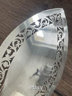 Antique pierced silver serving spoon with old man's hallmark