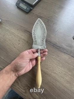 Antique pierced silver serving spoon with old man's hallmark