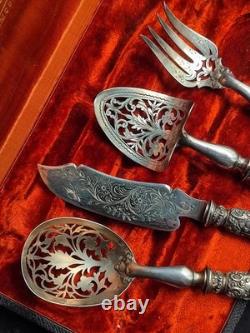 Antique silver and silver-filled dessert service in rocaille and putti style