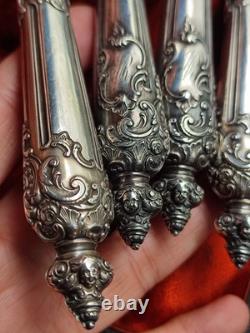 Antique silver and silver-filled dessert service in rocaille and putti style