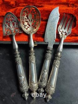 Antique silver and silver-filled dessert service in rocaille and putti style