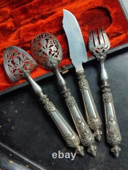 Antique silver and silver-filled dessert service in rocaille and putti style