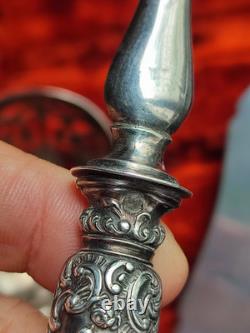 Antique silver and silver-filled dessert service in rocaille and putti style