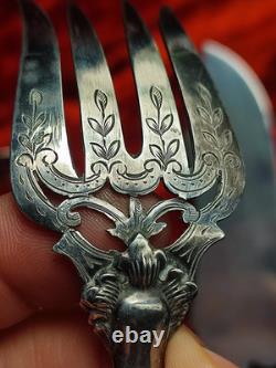 Antique silver and silver-filled dessert service in rocaille and putti style
