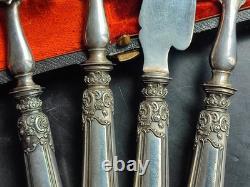 Antique silver and silver-filled dessert service in rocaille and putti style