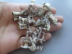 Antique silver bracelet with hallmarks, 13 assorted charms, approximately 36g, about 18cm long