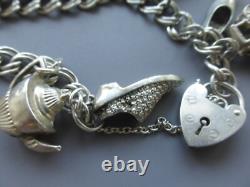 Antique silver bracelet with hallmarks, 13 assorted charms, approximately 36g, about 18cm long
