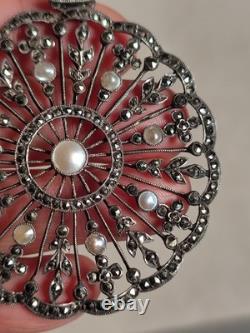Antique silver openwork pendant in round shape set with marcasites and pearls