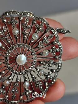 Antique silver openwork pendant in round shape set with marcasites and pearls