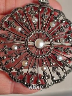Antique silver openwork pendant in round shape set with marcasites and pearls