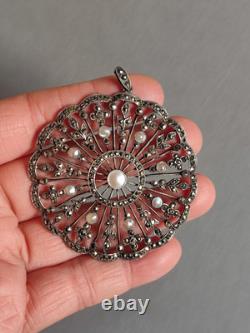Antique silver openwork pendant in round shape set with marcasites and pearls