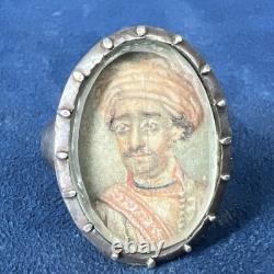 Antique silver ring with miniature portrait in Persian style on natural bone substrate