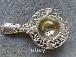 Antique solid silver and vermeil tea strainer by Johan and Kurz and Co
