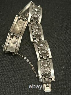 Antique solid silver bracelet with floral motif