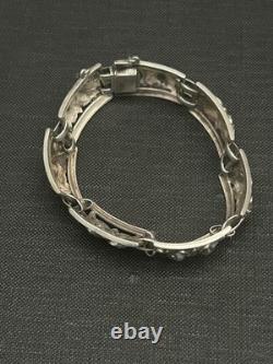 Antique solid silver bracelet with floral motif