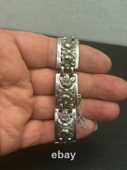 Antique solid silver bracelet with floral motif