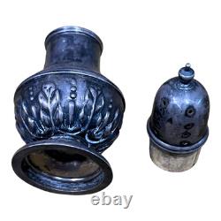 Antique vintage salt and pepper shakers in engraved solid silver