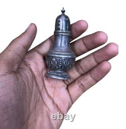 Antique vintage salt and pepper shakers in engraved solid silver