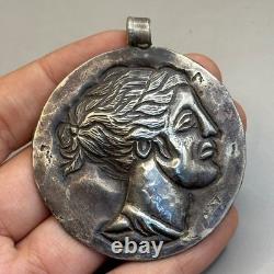 Beautiful ancient pendant in solid Greek Roman silver with image of a king