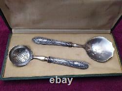 Cream spoon and 1 solid silver minerve stuffed antique sugar shaker.