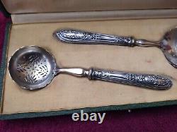 Cream spoon and 1 solid silver minerve stuffed antique sugar shaker.