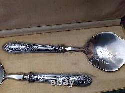 Cream spoon and 1 solid silver minerve stuffed antique sugar shaker.