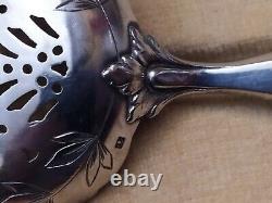 Cream spoon and 1 solid silver minerve stuffed antique sugar shaker.