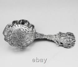 Magnificent Antique Silver Tea Strainer, richly chiseled Dutch style