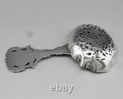 Magnificent Antique Silver Tea Strainer, richly chiseled Dutch style