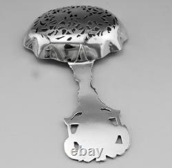 Magnificent Antique Silver Tea Strainer, richly chiseled Dutch style