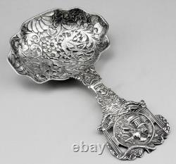 Magnificent Antique Silver Tea Strainer, richly chiseled Dutch style