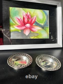 Old pair of solid silver plates with reticulated border, diameter 7.9 cm