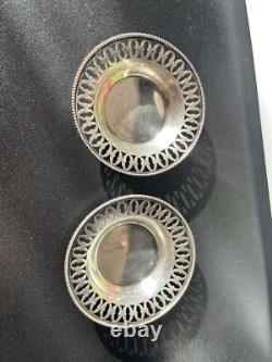 Old pair of solid silver plates with reticulated border, diameter 7.9 cm