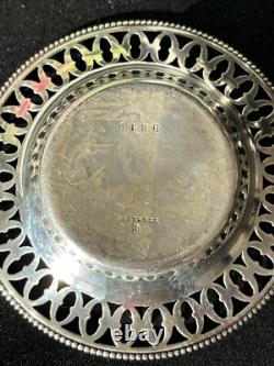 Old pair of solid silver plates with reticulated border, diameter 7.9 cm