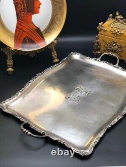 Translation: Ancient, very beautiful, large solid silver tray. 1 title. Rudolph Beunke